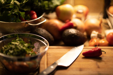 red hot chili pepper close up on a cutting board set on a kitchen counter
