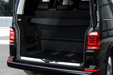 Modern car with open empty trunk outdoors