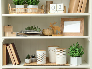 White shelving unit with different decorative elements