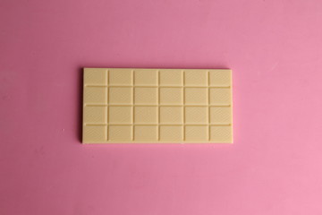 white chocolate tablet in color background
