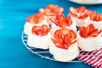 pavlova meringue nests with strawberry cream and fresh strawberries