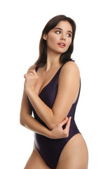 Fototapeta premium Beautiful young woman wearing swimsuit on white background