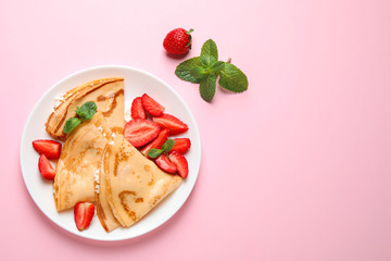 Delicious thin pancakes with strawberries and cottage cheese on pink background, flat lay. Space for text