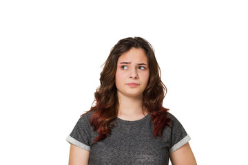 Fototapeta premium Young teenager thinking over a white background