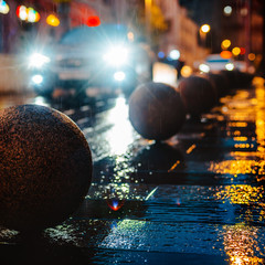 Wet night city street rain Bokeh reflection bright colorful lights puddles sidewalk Car