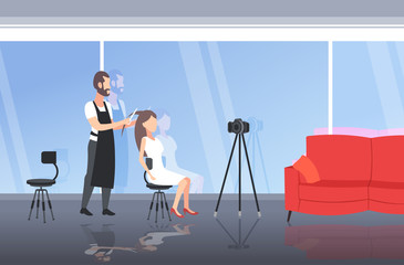 hairdresser blogger making hairstyle cutting hair tips of woman customer man recording online video with camera on tripod blogging concept modern beauty salon interior full length horizontal vector