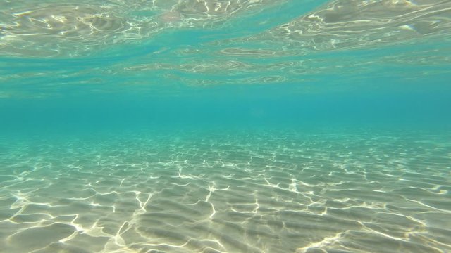 4k view of crystal clear sea water half underwater