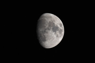 Blurred half moon in the dark night.