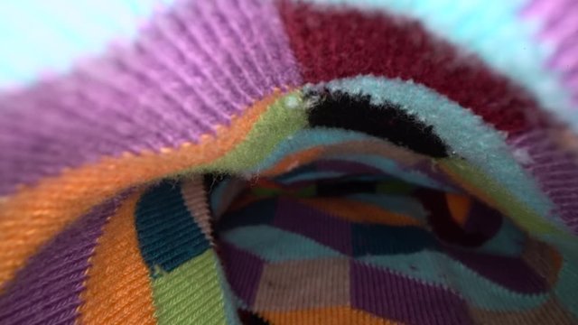 Inside the sock. Colourful macro dolly shot of an inside of sock texture. Gliding through the sock