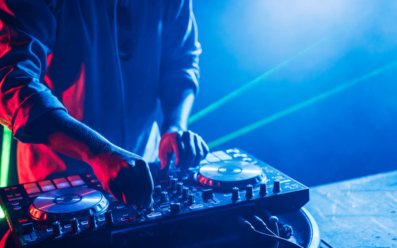 Dj mixes the track in the nightclub at a party, Christmas, new year