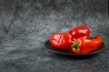 Red chili peppers in a black plate. 