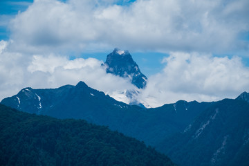 Obraz premium Snow capped mountain covered in clouds in Chilean Patagonia