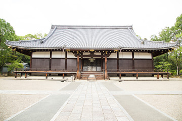 Obraz premium Photograph of the entrance to a Japanese temple with a stone garden