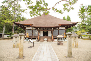Photograph of the entrance to a Japanese temple with a stone garden