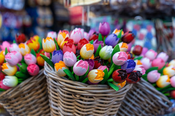 Fototapeta na wymiar wooden tulips in basket tourist shop