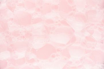 Pink soapy water with bubbles as elegant abstract spring festive background.