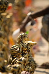 Women statue golden color at footpath for selling in india