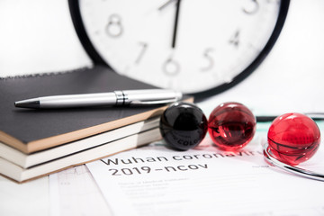Medicine documents with small glass balls on it. Abstract photo of illness time.