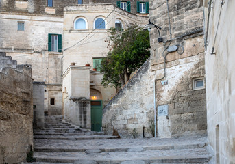Obraz premium Cobblestone street in the Sassi di Matera a historic district in the city of Matera. Basilicata. Italy