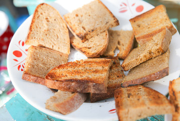 Grilled bread toasts on the plate.