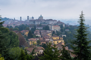 Fototapeta na wymiar View on Old Bergamo on a cold, foggy day. Italy