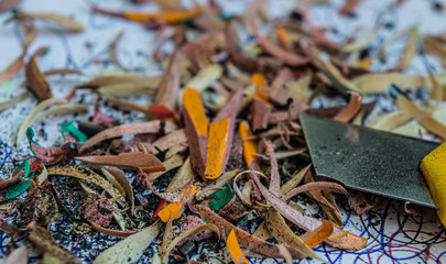 wooden shavings from graphic pencils and stationery knife closeup