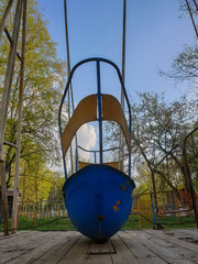 Vologda. Spring. Old abandoned rides in Veterans Park. Ferris wheel