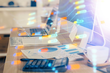Double exposure of desktop computer and technology theme hologram. Concept of software development.