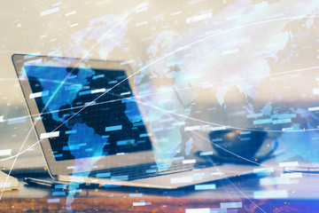 Double exposure of desktop computer and technology theme hologram. Concept of software development.