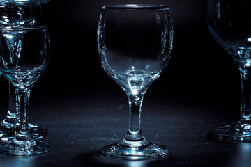 Empty  glasses for drinks on dark background