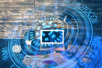 Double exposure of laptop computer and technology theme hologram. Concept of freelance work.