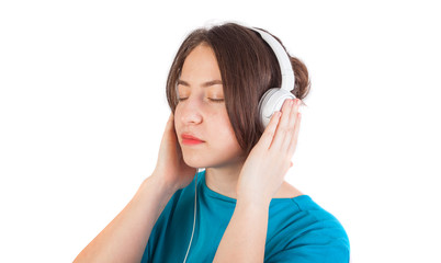 girl listen music on headphones. isolated on white