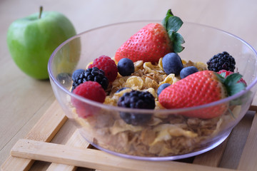 Close up of berry fruit on oat in a bowl 