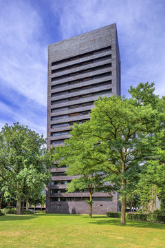 TILBURG-JULY 9, 2017. High rise apartment building Cenakel, located at the border of Tilburg. The characteristic black brick tower houses 36 apartments, it is designed by architect Jacq de Brouwer.