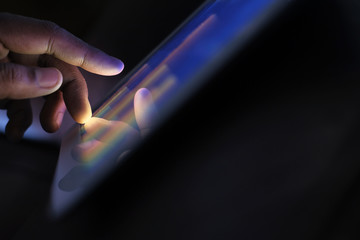 Close up of man hand analyzing chart on digital tablet.