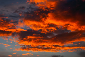 Beautiful Twilight sky background. Colorful Fiery orange and red sunset sky.