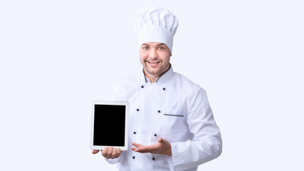 Chef Showing Blank Tablet Screen Standing Over White Background, Panorama