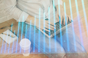 Forex graph with businessman working on computer in office on background. Concept of analysis....