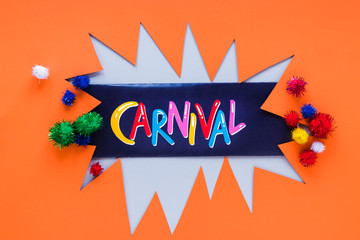 Carnival paper cut-out with colorful pom-poms