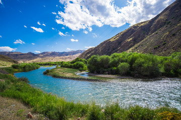 Fototapeta na wymiar Stream / River, en route from Naryn - Bishkek, Kyrgyzstan. The Tien Shan range. 