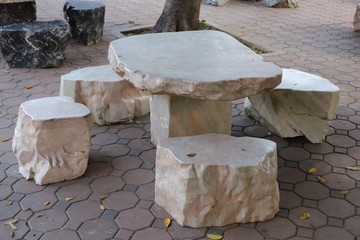 Table and chairs made of stone.