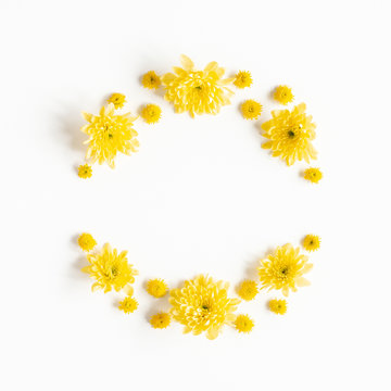 Flowers composition. Wreath made of yellow chrysanthemum flowers on white background. Flat lay, top view