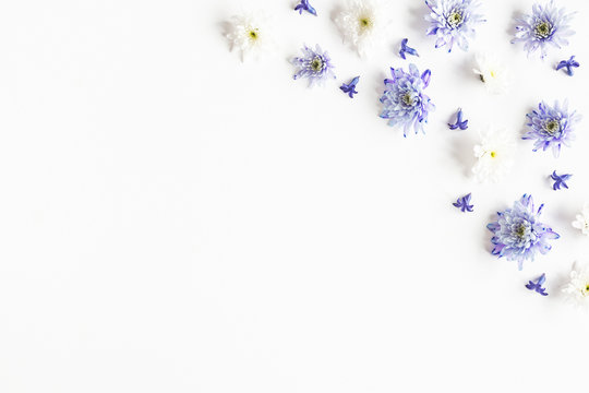 Flowers composition. Frame made of chrysanthemum flowers on white background. Flat lay, top view