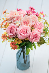 A bouquet of pink roses in a vase