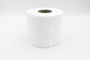 A white row of toilet paper with brown paper core lay on white background. Close up, side view with copy space.