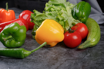 Colorful peppers with lettuce and zucchini.