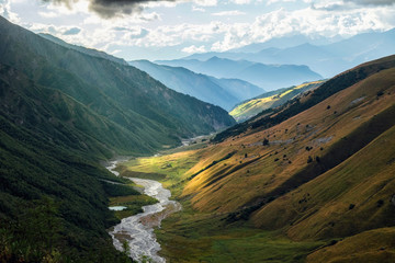 Aerial view to Adishchala glacier river valley and mountains of Svaneti Georgia while trekking