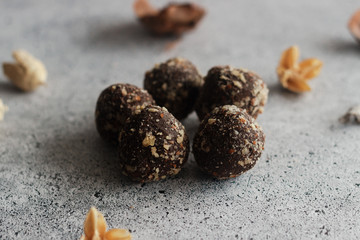 Chocolate homemade truffles. Tasty sweets on the table. Nuts sprinkled with sweets