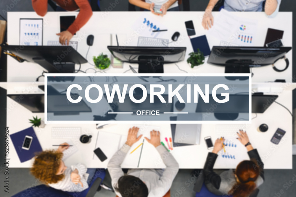 Poster coworking lettering over top view of working team