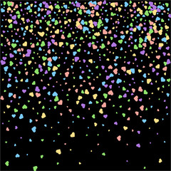 Fototapeta na wymiar Background from bright multi-colored confetti. Festive heart shaped confetti. Joyful confetti on a black background. Bright colorful background.